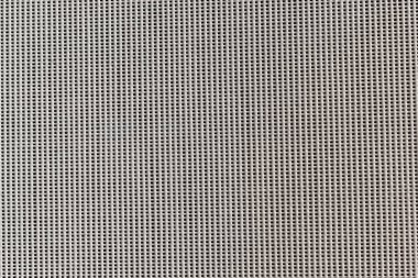 Kare delikli beyaz dekoratif duvar tahtası. doku duvar kağıdı, şablon dolguları, web sayfası arkaplanı, yüzey dokuları için kullanılabilir