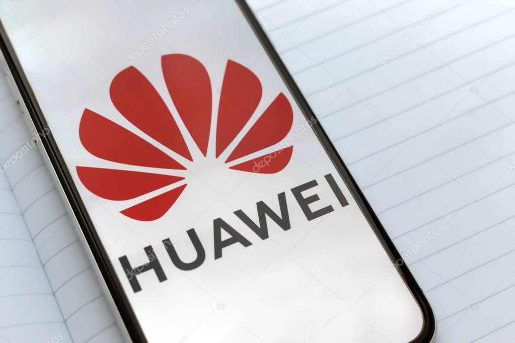 Kyiv, Ukraine  May 21, 2019: the logo of Huawei Technologies on the white screen of the frameless display. Huawei is Losing Google support
