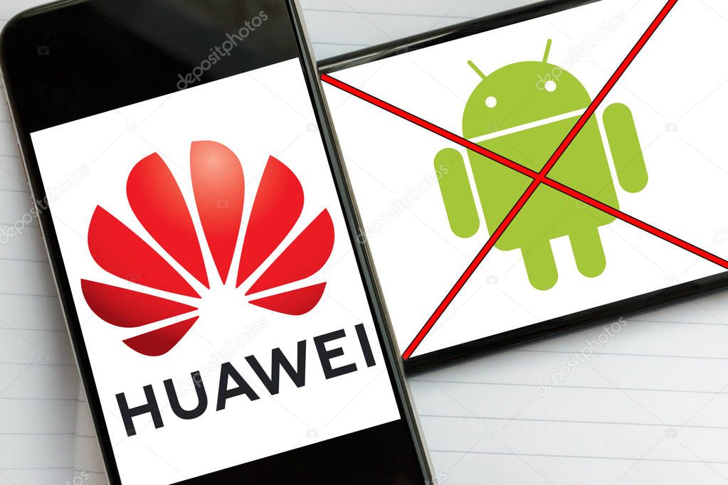 Kyiv, Ukraine - May 21, 2019: Logo of Huawei Technologies and crossed out logo of Android operating system on screens of the modern smartphones. Google has blocked Huawei's future access to Android updates