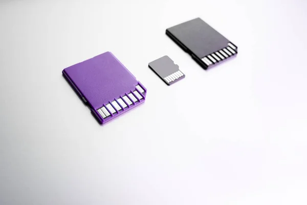 Purple Black Memory Cards White Surface Selective Focus Black Memory — Stock Photo, Image