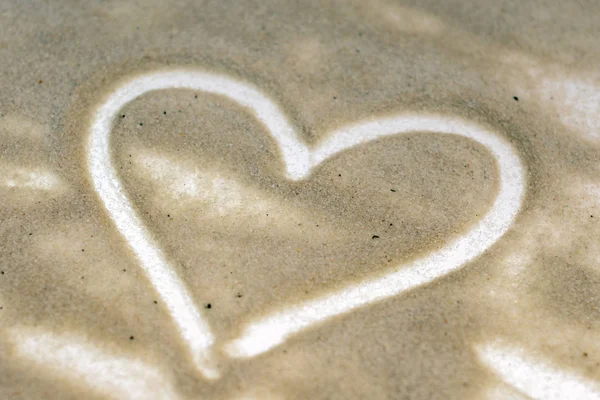 a simple heart drawn on the sand for Valentine\'s day. concept. copy space