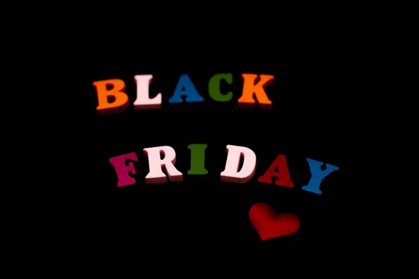 black Friday inscription in colored letters on a black background