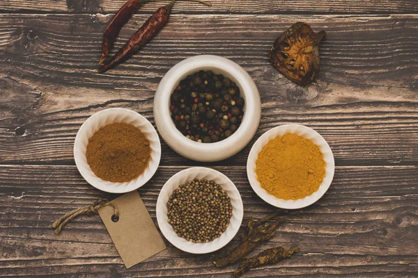 The spices of the world are bright and colorful for culinary gourmet dishes in the kitchen. — Stock Photo, Image