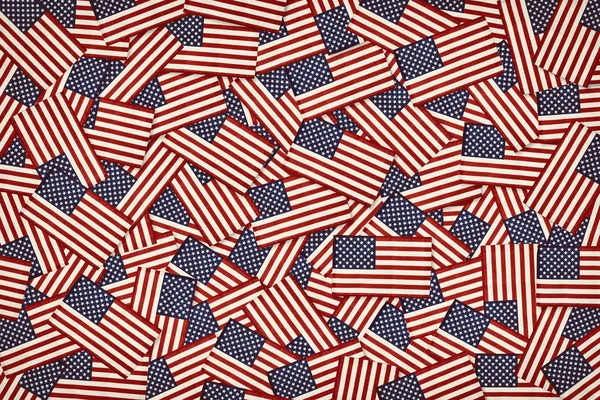 Miniature American flags background pattern. Vintage toned.