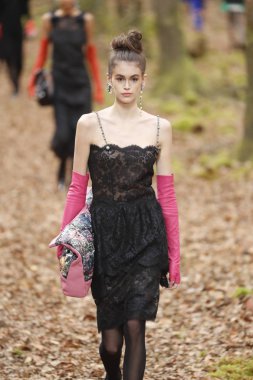 PARIS, FRANCE - MARCH 06: Kaia Gerber walks the runway during the Chanel show as part of the Paris Fashion Week Womenswear Fall/Winter 2018/2019 on March 6, 2018 in Paris, France.  clipart