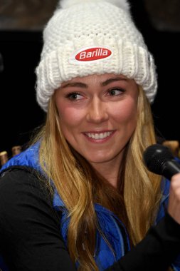 KILLINGTON, VT - NOVEMBER 23: Mikaela Shiffrin answers questions from the media during a press conference prior to the Killington Cup at Killington Ski Resort on November 23, 2018 in Killington, Vermont. clipart