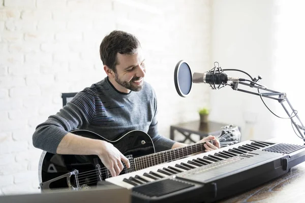 Handsome Hispanic Man Enjoying Playing Guitar Radio Station Playing Music — Stock Photo, Image