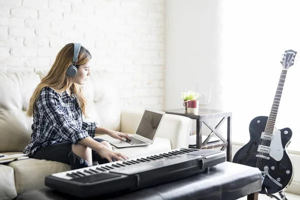 Pretty Young Woman Sitting Sofa Wearing Headphones Composing Music Using — Stock Photo, Image