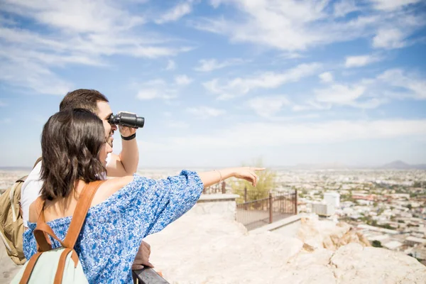 Smiling Man Holding Binocular While Latin Woman Pointing Something — Stock Photo, Image