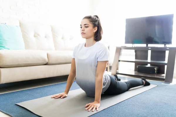 Hispanic Young Woman Practicing Cobra Pose Living Room — Stock Photo, Image