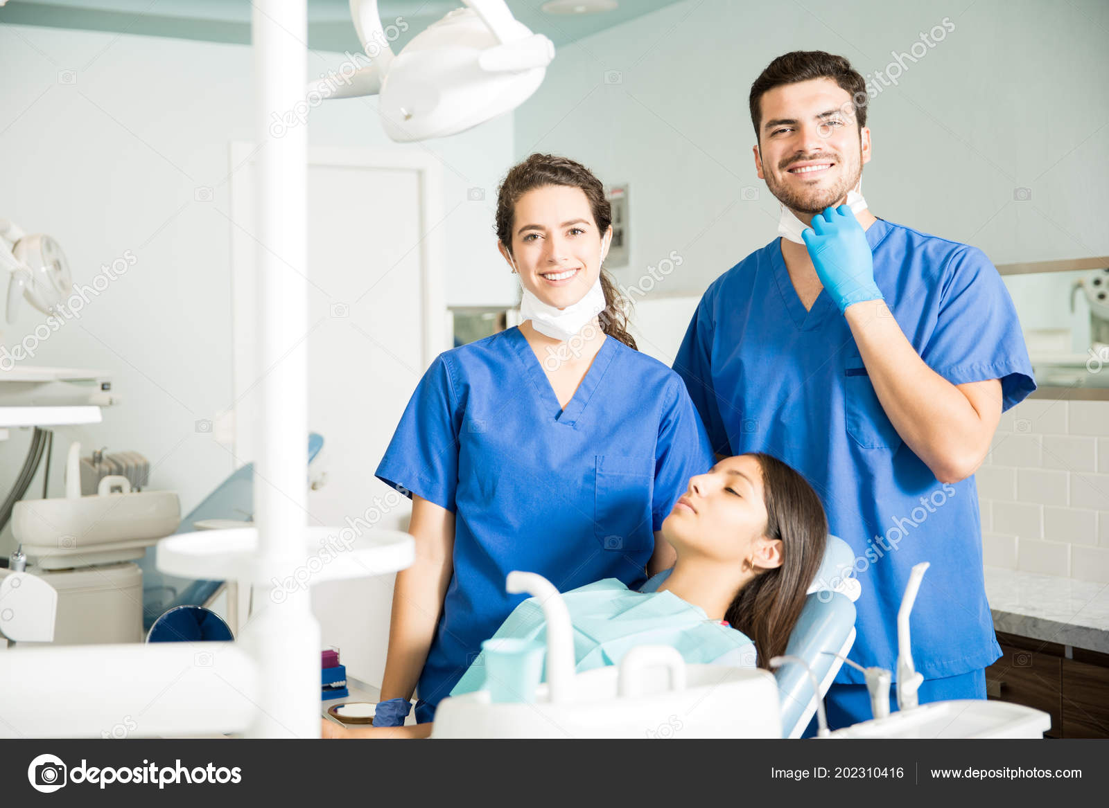 Portrait Male Female Dentists Standing Patient Dental Clinic Stock