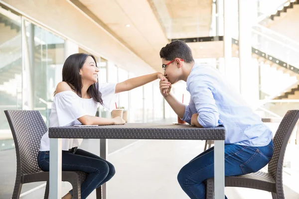 Teenage Boy Kissing Girlfriend Hand While Sitting Cafe Shopping Center — Stock Photo, Image