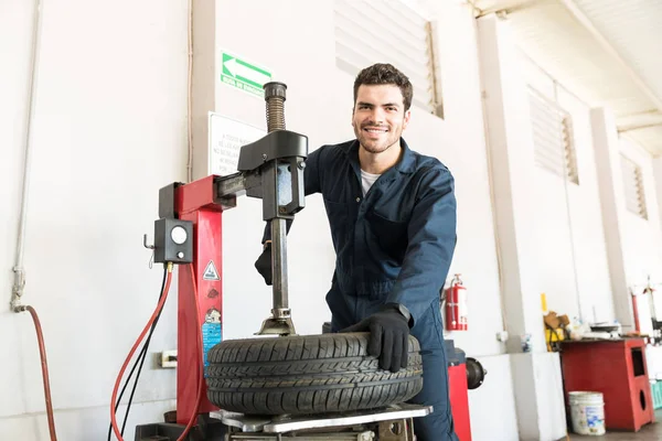 Portrait Smiling Mid Adult Serviceman Uniform Using Tire Changer Garage — Stock Photo, Image