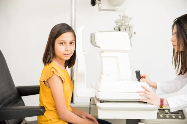 Portrait Cute Little School Girl Getting Eye Check Done While — Stock Photo, Image