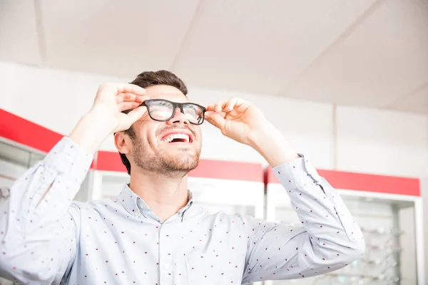 Smiling Man Holding Black Frames Eyeglasses Laughing While Looking Camera — Stock Photo, Image