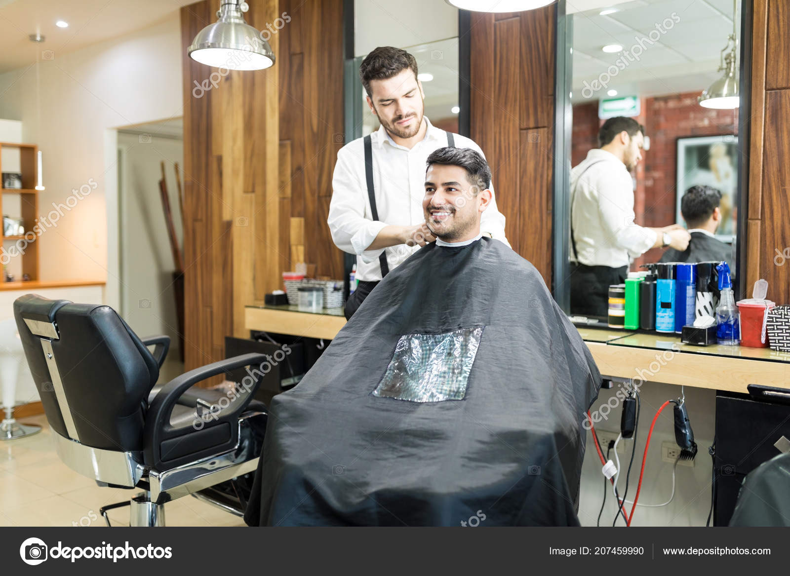 Young Hairdresser Adjusting Cape Smiling Customer Salon Stock