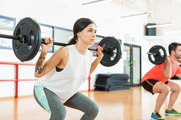 Focused Beautiful Woman Looking Away While Doing Barbell Squats Health — Stock Photo, Image
