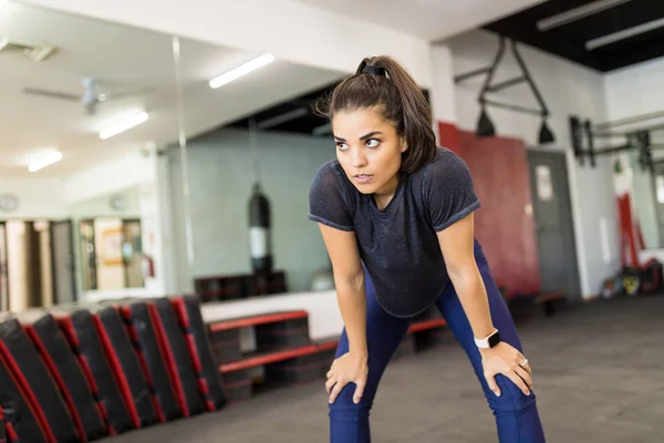Exhausted Young Woman Leaning Knees Workout Gym — Stock Photo, Image