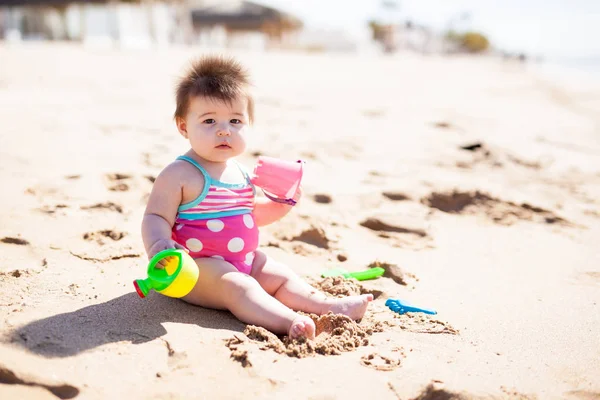 Little Baby Girl Bathing Suit Playing Sand Buckets Sunny Beach — Stock Photo, Image