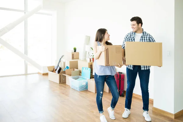 Full Length Happy Couple Looking Each Other While Setting New — Stock Photo, Image