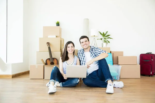 Male Female Owners Laptop Sitting Floor Cardboard Boxes New Home — Stock Photo, Image