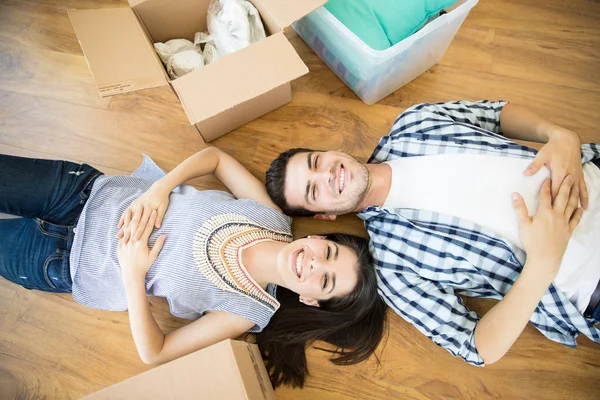 Overhead View Happy Man Woman Lying Cardboard Boxes Hardwood Floor — Stock Photo, Image