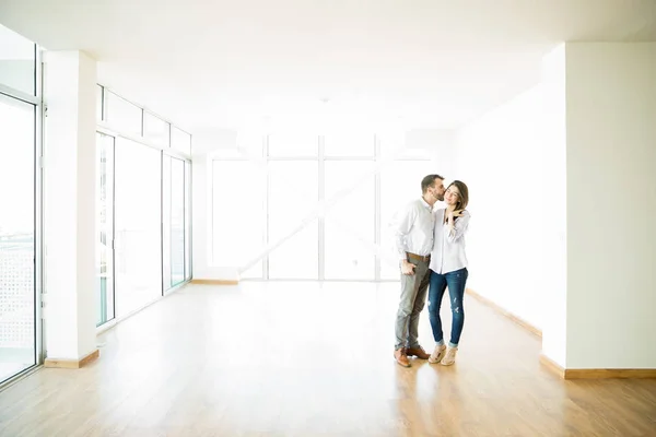 Full Length Mid Adult Man Kissing Woman Cheek New Apartment — Stock Photo, Image