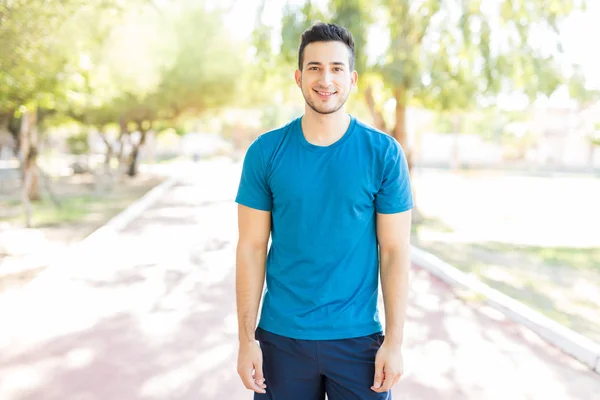 Portrait Male Athlete Smiling While Standing Footpath Park — Stock Photo, Image