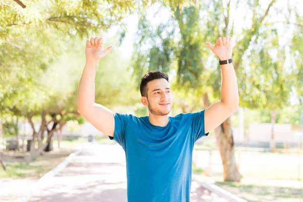 Smiling Male Jogger Arms Raised Celebrating Success While Standing Park — Stock Photo, Image