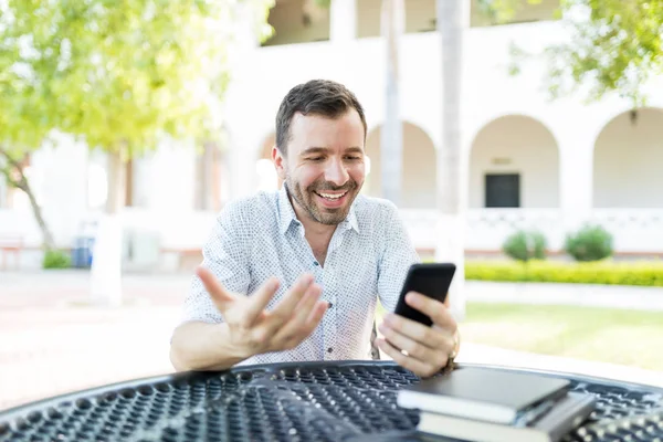 Happy Mid Adult Man Communicating Video Call Mobile Phone While — Stock Photo, Image