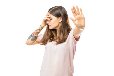 Beautiful woman with bad mood gesturing stop symbol over white background clipart