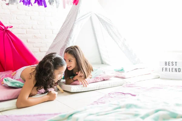 Preteen Girl Sharing Secrets Friend While Lying Tipi Tent Home — Stock Photo, Image