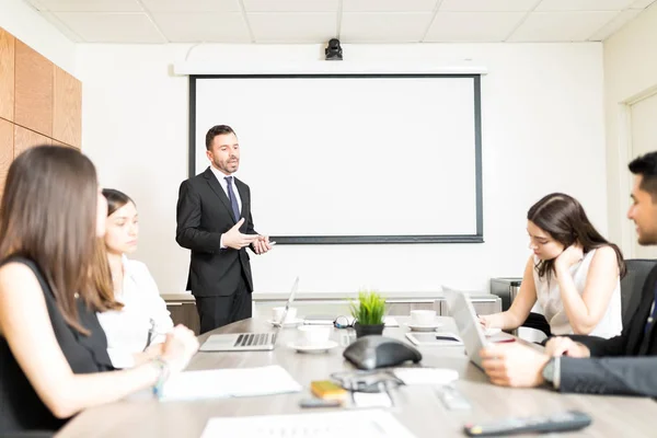 Confident Mid Adult Businessman Giving Presentation Colleagues Boardroom — Stock Photo, Image