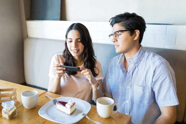 Young Guy Looking Girlfriend Taking Picture Cheesecake Cafe — Stock Photo, Image