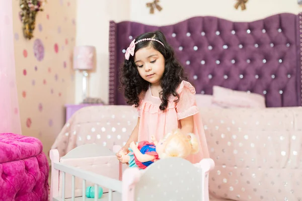 Female Offspring Putting Doll Sleep Crib Her Bedroom Home — Stock Photo, Image