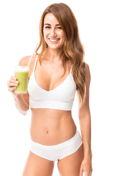 Happy Woman Holding Glass Green Detox Juice While Standing Studio — Stock Photo, Image