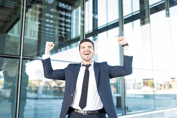 Cheerful Hispanic Businessman Raising Arms Celebrating Victory Office Building — Stock Photo, Image