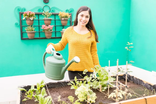 Portrait Smiling Urban Woman Watering Small Plants Garden — Stock Photo, Image