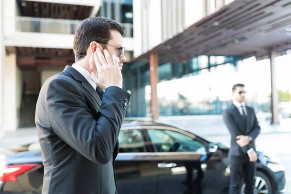 Confident Secret Service Agent Listening Updates Security Earpiece While Waiting — Stock Photo, Image