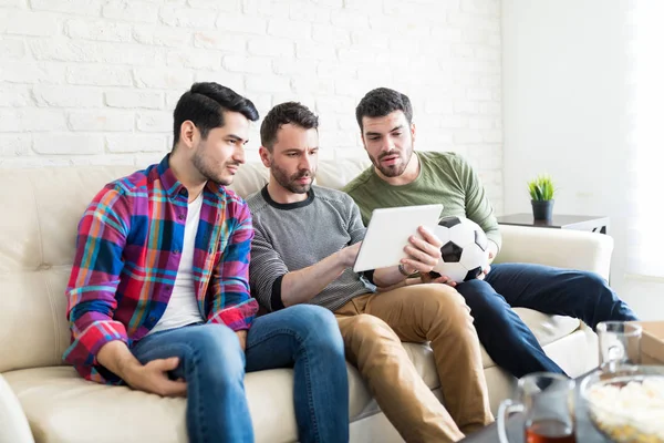 Latin Best Buddies Watching Live Soccer Match Tablet While Sitting — Stock Photo, Image