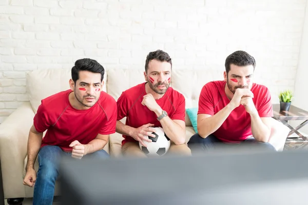 Latin Friends Painted Faces Watching Each Move Soccer Player Cautiously — Stock Photo, Image