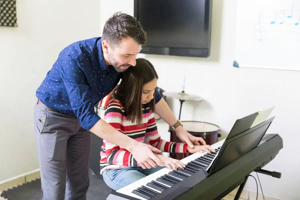 Music Teacher Guiding Teen Student Play Electric Instrument Classroom — Stock Photo, Image