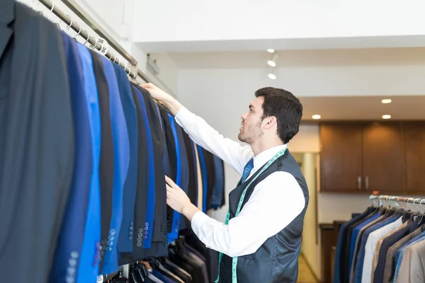 Side View Good Looking Male Seamster Arranging Suits Rack Clothing — Stock Photo, Image