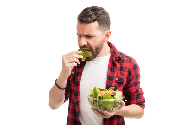 Disgusted Mid Adult Man Eating Lettuce Bowl Studio — Stock Photo, Image