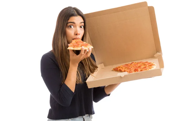 Attractive Young Woman Eating Slice Delicious Pizza While Holding Cardboard — Stock Photo, Image