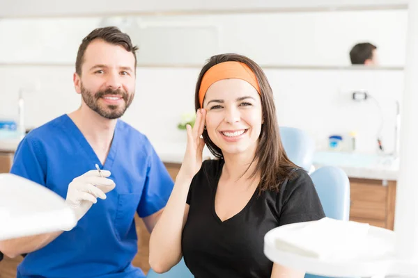 Portrait Confident Doctor Smiling Patient Touching Her Eye Getting Botox — Stock Photo, Image