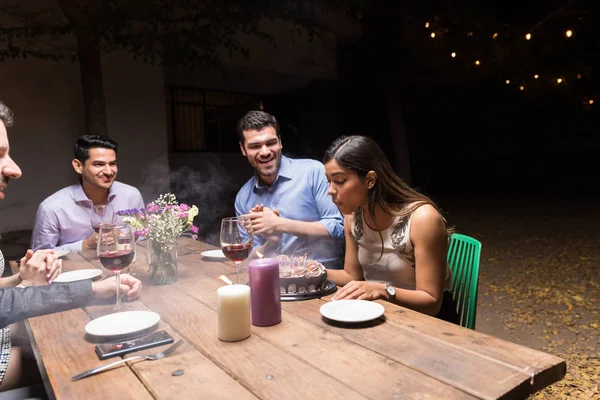 Woman Blowing Birthday Candles Cake While Celebrating Friends Backyard Party — 스톡 사진