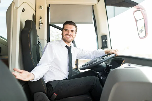 Portrait of happy driver inviting on board of intercity bus