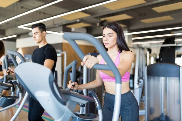 Active Young Woman Holding Handles While Walking Treadmill — Stock Photo, Image