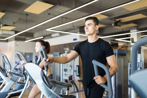 Focused Young Man Walking Treadmill Looking Away Gym — Stock Photo, Image